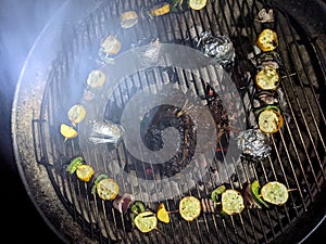 T-Bone Steak, Potatoes and Vegetable Kabobs on a Grill