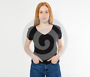 T-shirt design, happy people concept - smiling red hair woman in blank black t-shirt pointing her fingers at herself, red head