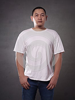 T-shirt mock up, front view. Male model wear plain white tshirt mockup. Shirt design template
