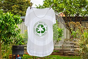 T shirt on washing line with circular economy textiles icon, make, use, reuse, swap, donate, recycle