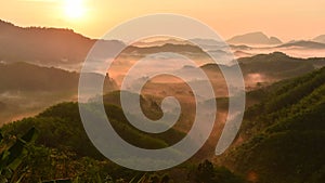 Ta tun tone din hill. Foggy morning view at sunrise. Scenic mountains, lush green complex