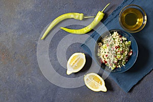 Tabbouleh salad with couscous, parsley, lemon, tomato, olive oil. Levantine vegetarian salad