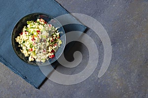 Tabbouleh salad with couscous, parsley, lemon, tomato, olive oil. Levantine vegetarian salad