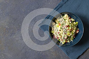 Tabbouleh salad with couscous, parsley, lemon, tomato, olive oil. Levantine vegetarian salad