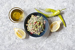 Tabbouleh salad with couscous, parsley, lemon, tomato, olive oil. Levantine vegetarian salad