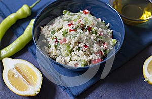 Tabbouleh salad with couscous, parsley, lemon, tomato, olive oil. Levantine vegetarian salad