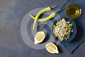 Tabbouleh salad with couscous, parsley, lemon, tomato, olive oil. Levantine vegetarian salad