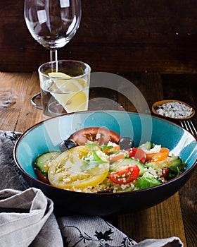 Tabbouleh salad on dark wooden background