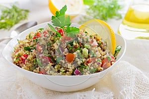 Tabbouleh salad with quinoa, parsley and vegetables