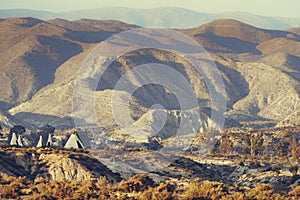 Tabernas desert and Indian village wigwams at Western Leone, Spain photo