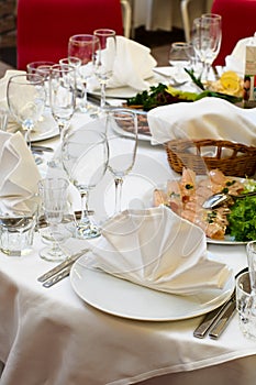 Table appointments for dinner in restaurant