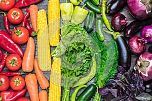 A table arrangement of a variety of fresh fruits and vegetables sorted by colors