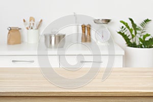 Table background of free space on blurred kitchen counter interior