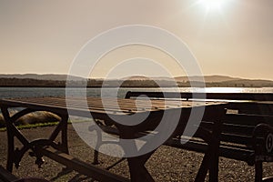 A table and a beach and the sun