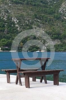 Table and benches on the pier of Kotor Bay. Montenegro