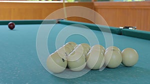 Table for billiards with a pyramid of balls