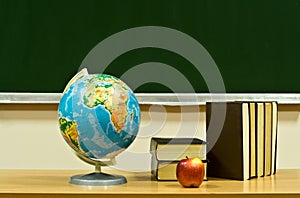 Table with books and apple