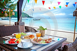 Table with breakfast on the beach.