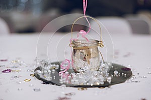 A table centrepiece on the table at a wedding reception or wedding breakfast