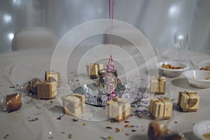 A table centrepiece on the table at a wedding reception or wedding breakfast