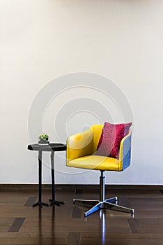 Table Chair combination in front of a plain wall