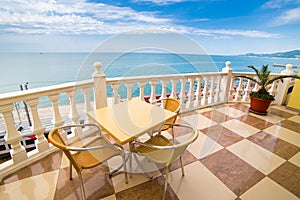 Table with chair on seaside open-air sea sky