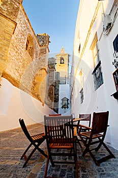 Table and chairs in alley