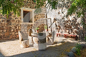 Table and chairs in a courtyard at the San Ignacio Mission