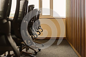 Table and chairs in empty business conference room interior