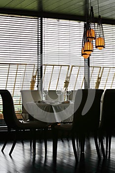 Table and chairs in empty restaurant