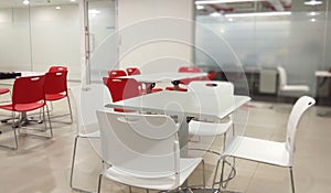 Table chairs in a hygienic dinning hall of an office.