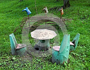 Table and chairs made of stumps and natural material