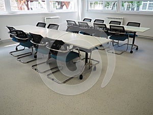 table and chairs in the meeting room in the office, in the classroom or in the library hall. White, black and gray