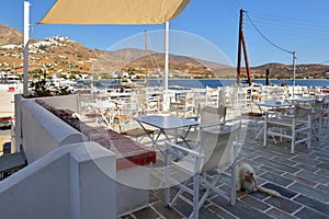 Table and chairs with sea view. Serifos Island. Greece