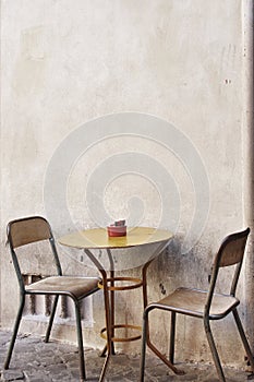 A Table And Chairs On the stereet