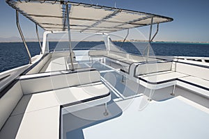 Table and chairs on sundeck of a luxury motor yacht