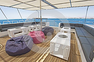 Table and chairs on sundeck of a luxury motor yacht