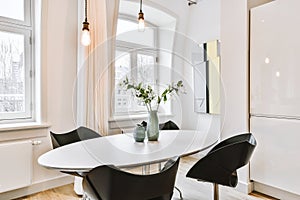 Table with chairs and vases in dining room