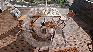 table chairs wooden in wooden balcony with gllass for summer vaccation photo