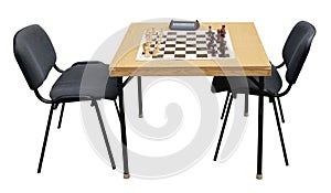 A table with a chessboard and chess timer isolated