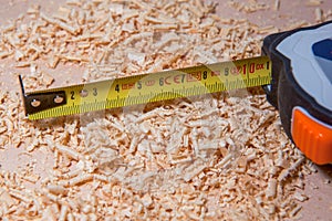 Table with chisel blades and shavings of wood sawdust and nails work of an artisan carpenter.