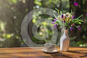 Table at coffee shop. Hot espresso the best start to any morning at cafe with copy space. Fresh spring summer floral background