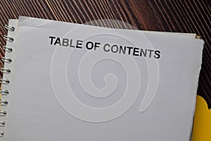 Table of Contents write on a paperwork isolated on wooden table