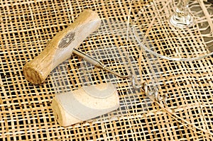 On the table, corkscrew and wine cork