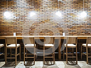 Table counter Bar with Chairs and Lights Brick wall background