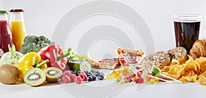 Table covered in assorted food and drinks