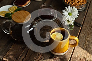 Table with cup of tea and food for morning breakfast.