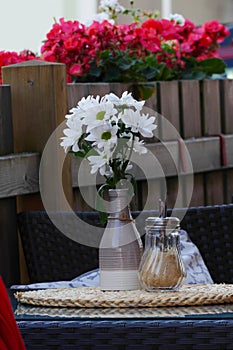 Table with daysi bouquet photo