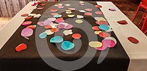 table decorated with coloured circles made of papier mache