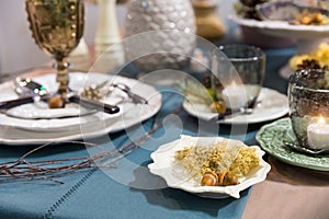 Table decorated with luxury dishes closeup, nobody